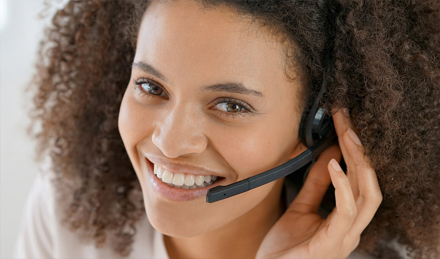 Portrait of customer service assistant talking on phone