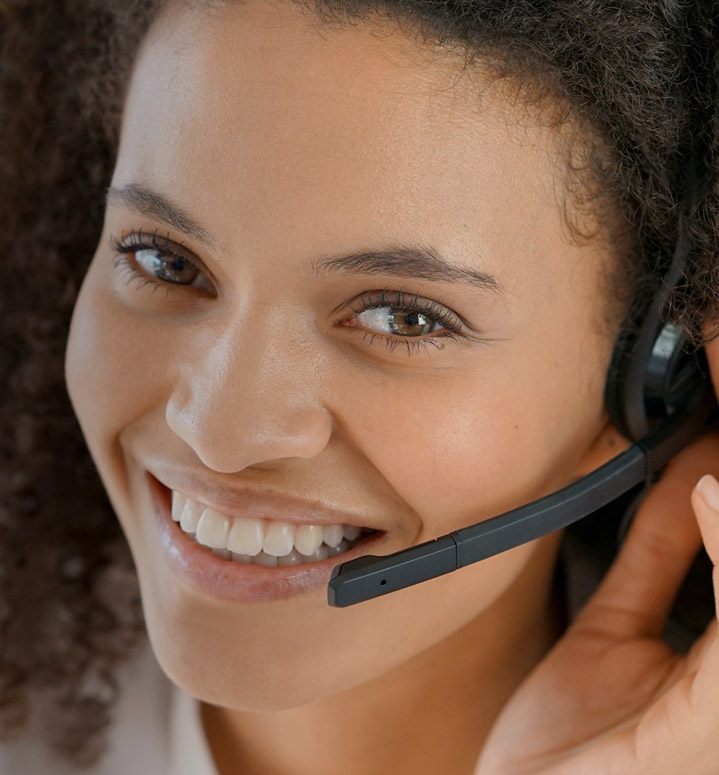 Portrait of customer service assistant talking on phone